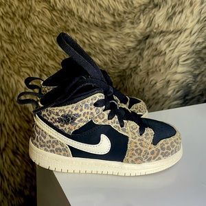 Cheetah print Kids Nike shoes size 8C. Gently used. Clean.